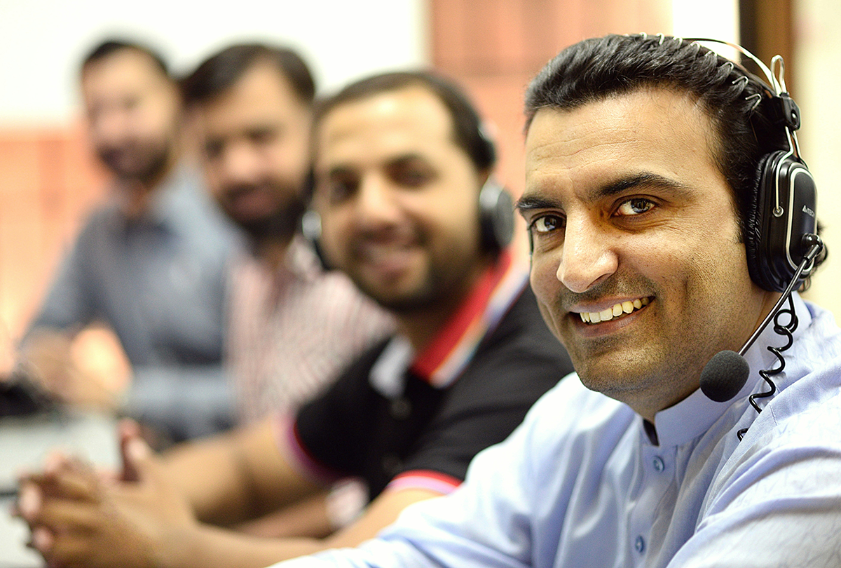 Licensed agents working on headsets